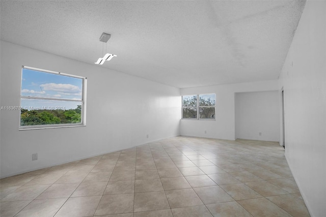 spare room with light tile patterned floors