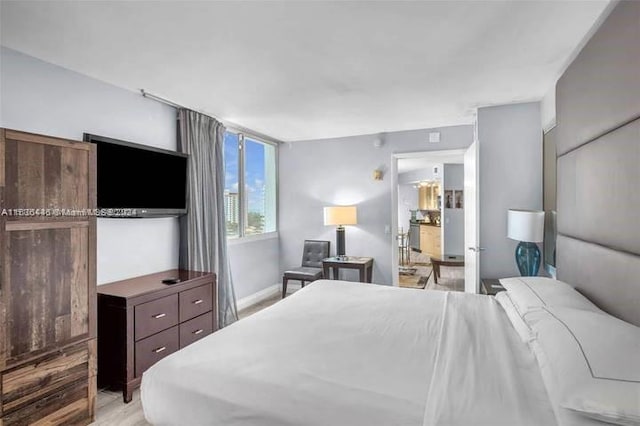 bedroom with light hardwood / wood-style flooring