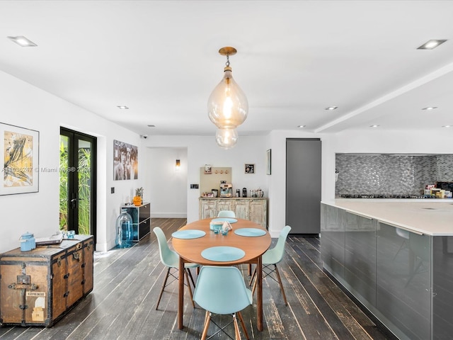 dining space featuring dark wood-type flooring and french doors