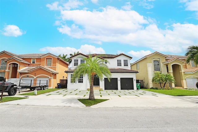 mediterranean / spanish house featuring a garage