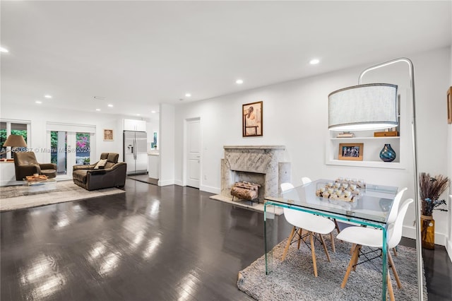 office area with a fireplace, french doors, and dark hardwood / wood-style floors