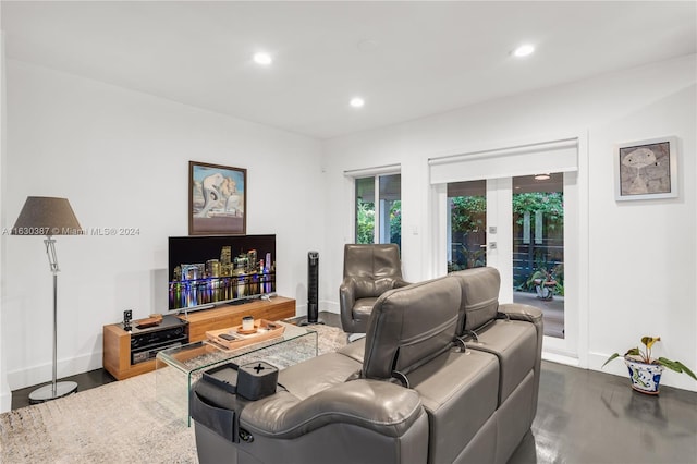 living room featuring wood-type flooring and french doors