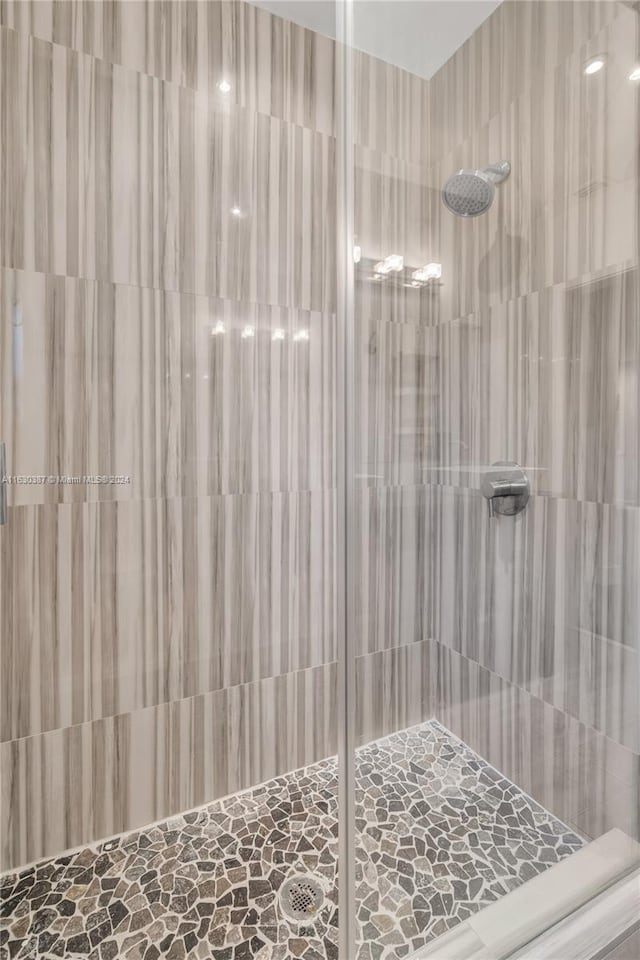 bathroom with a tile shower