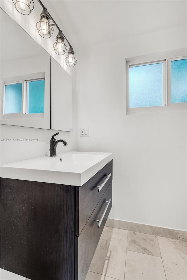 bathroom with vanity and tile patterned flooring