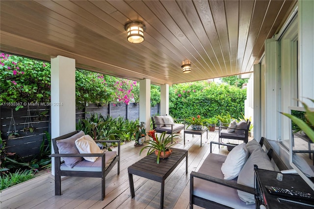 wooden terrace featuring an outdoor hangout area