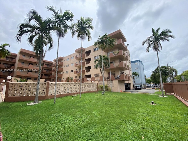 view of building exterior featuring fence