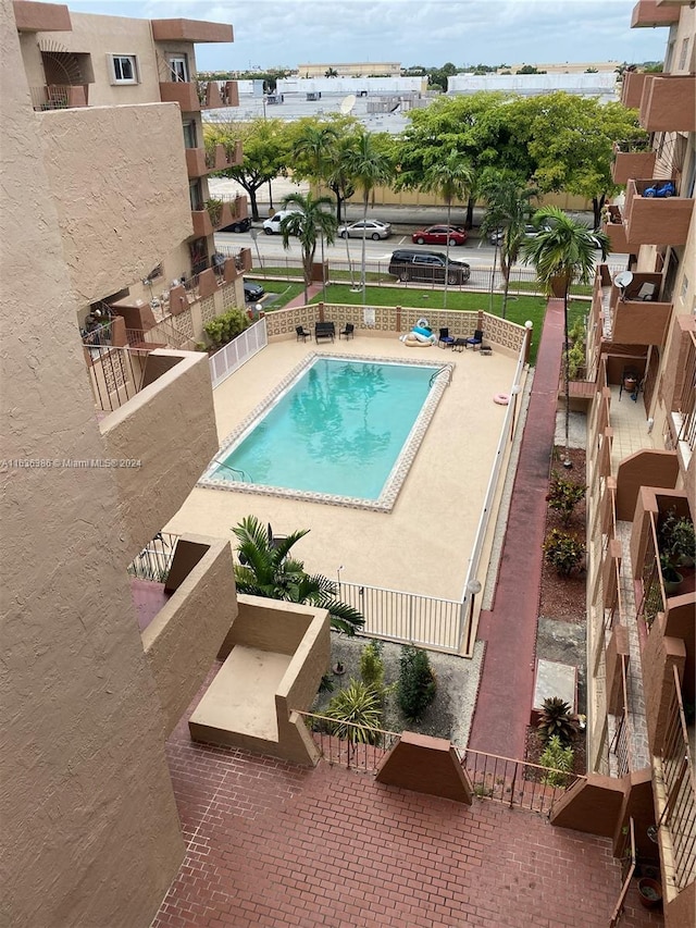 view of swimming pool with a patio