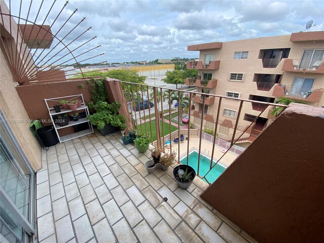 balcony featuring a pool