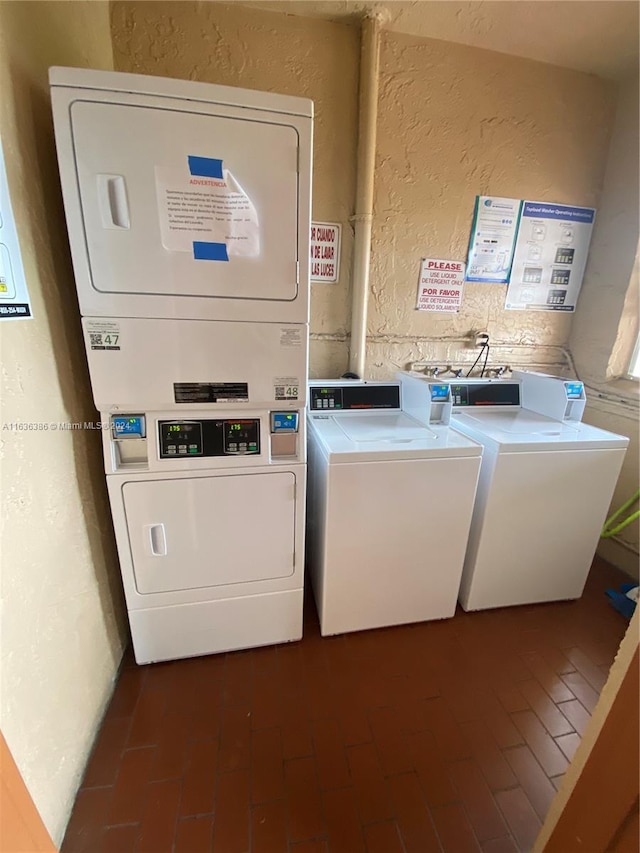 laundry room featuring washing machine and dryer and stacked washing maching and dryer