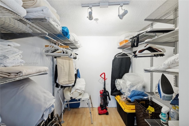 walk in closet featuring hardwood / wood-style floors