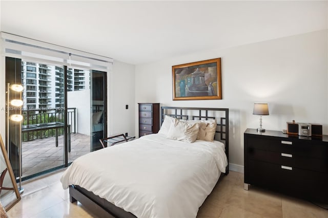 tiled bedroom featuring access to outside