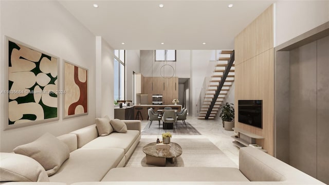 living room with a wealth of natural light and a high ceiling