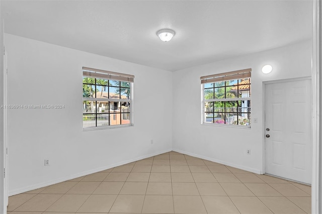 279 NW 119th Ave, Miami, FL 33182 - empty room with light tile patterned floors and baseboards