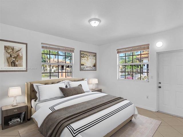 279 NW 119th Ave, Miami, FL 33182 - bedroom featuring light tile patterned flooring, baseboards, and multiple windows