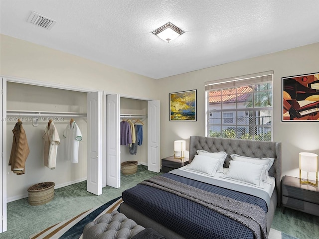 279 NW 119th Ave, Miami, FL 33182 - carpeted bedroom with baseboards, a textured ceiling, visible vents, and two closets