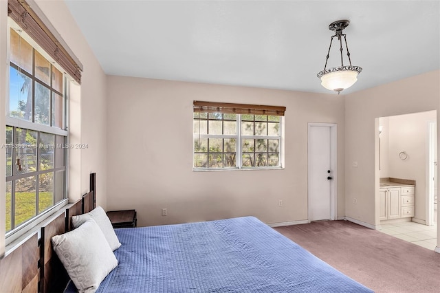 279 NW 119th Ave, Miami, FL 33182 - bedroom with baseboards, ensuite bath, and light colored carpet