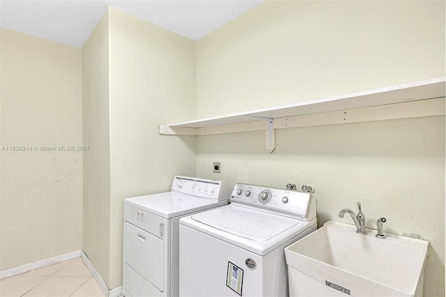 279 NW 119th Ave, Miami, FL 33182 - clothes washing area with independent washer and dryer, light tile patterned floors, baseboards, a sink, and laundry area