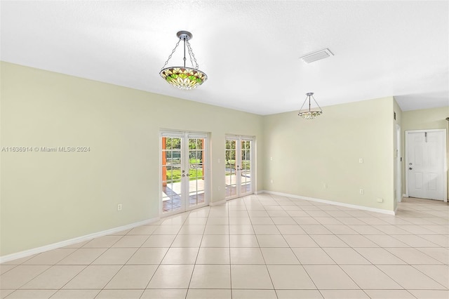 279 NW 119th Ave, Miami, FL 33182 - spare room with french doors, light tile patterned floors, baseboards, and visible vents
