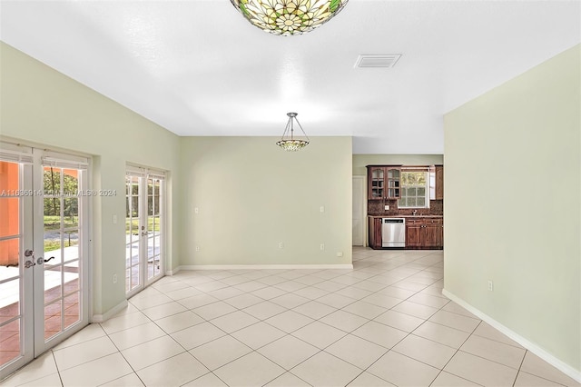 279 NW 119th Ave, Miami, FL 33182 - unfurnished room with baseboards, visible vents, french doors, and light tile patterned floors