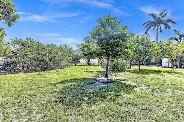 279 NW 119th Ave, Miami, FL 33182 - view of yard with a storage unit, an outbuilding, and fence