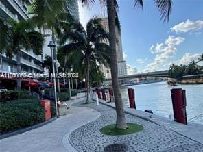 surrounding community featuring a water view