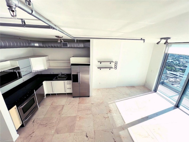 kitchen with sink and appliances with stainless steel finishes