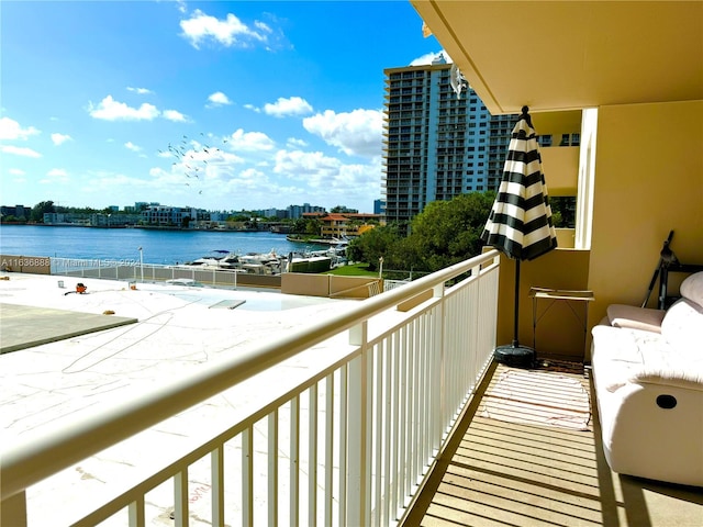 balcony featuring a water view