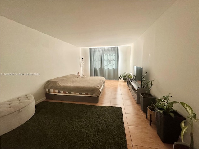 bedroom featuring light tile patterned floors