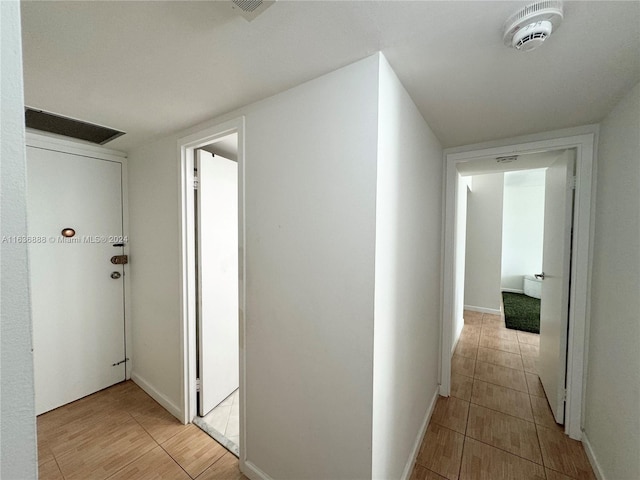 corridor featuring light hardwood / wood-style flooring