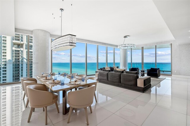 tiled dining space with a water view and a wall of windows