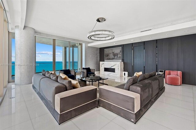 tiled living room with a water view