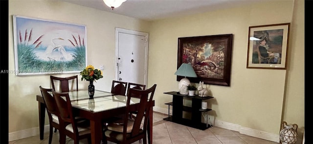 dining space with light tile patterned flooring