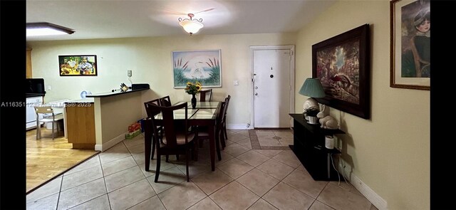 dining space featuring light wood finished floors