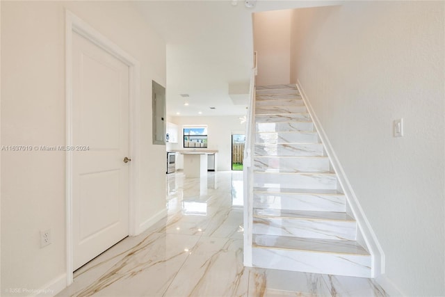 28725 SW 133rd Ct Unit 28725, Homestead, FL 33033 - stairway with marble tiled flooring, electric panel, and baseboards