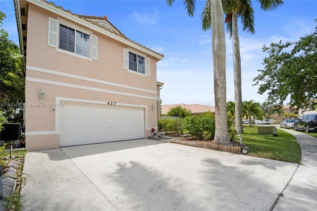 front of property featuring a garage