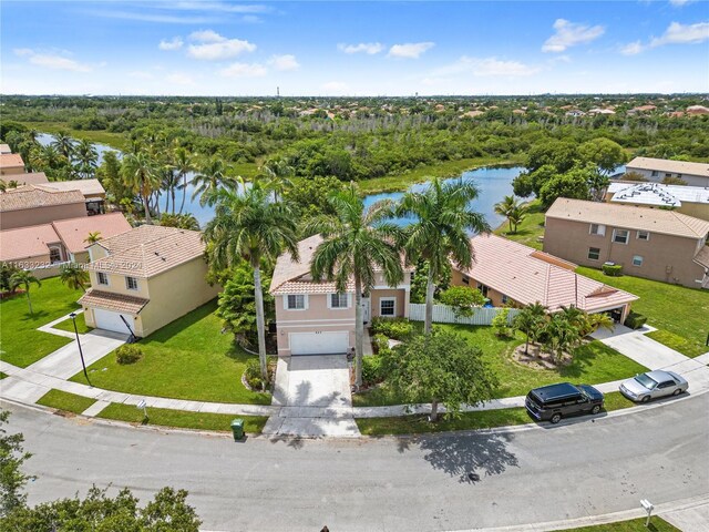 birds eye view of property with a water view