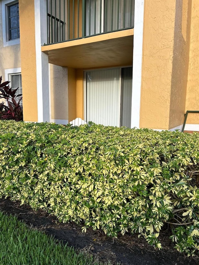 entrance to property with a balcony