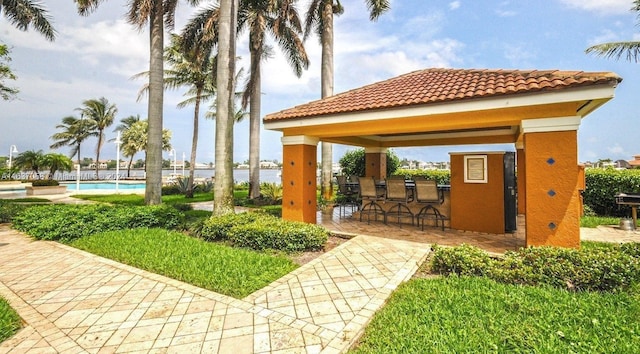 exterior space featuring exterior bar and a gazebo