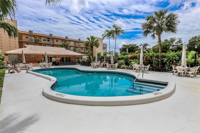 view of pool featuring a patio