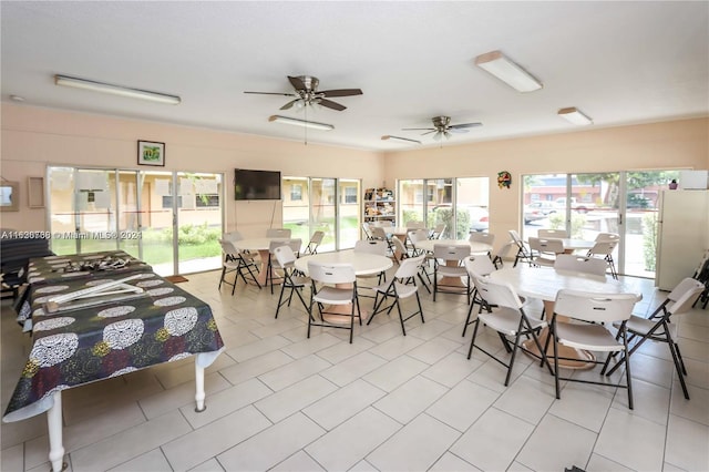 interior space with ceiling fan