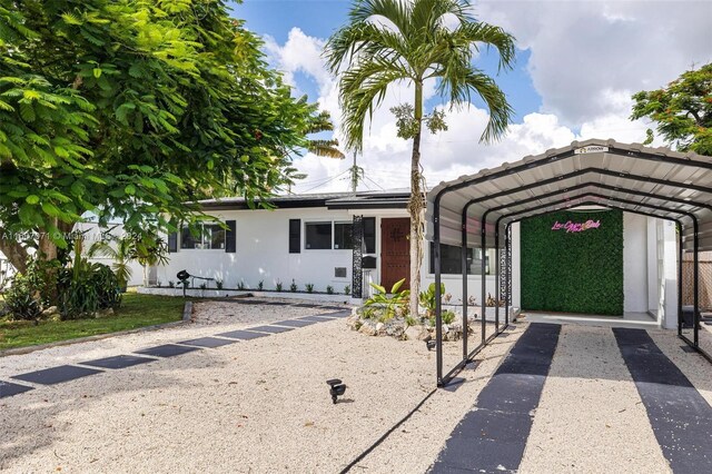 view of front of property with a carport