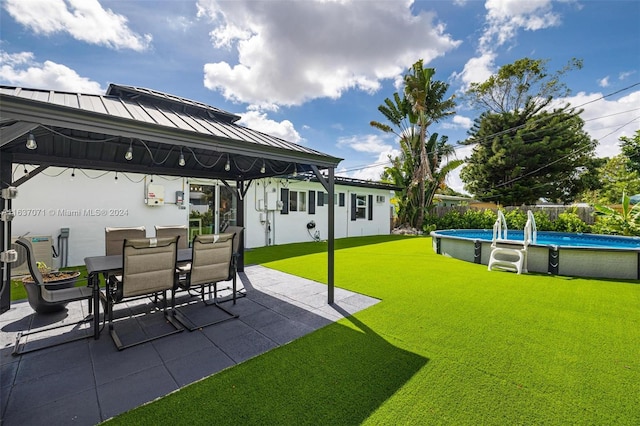 view of yard featuring a patio and a gazebo