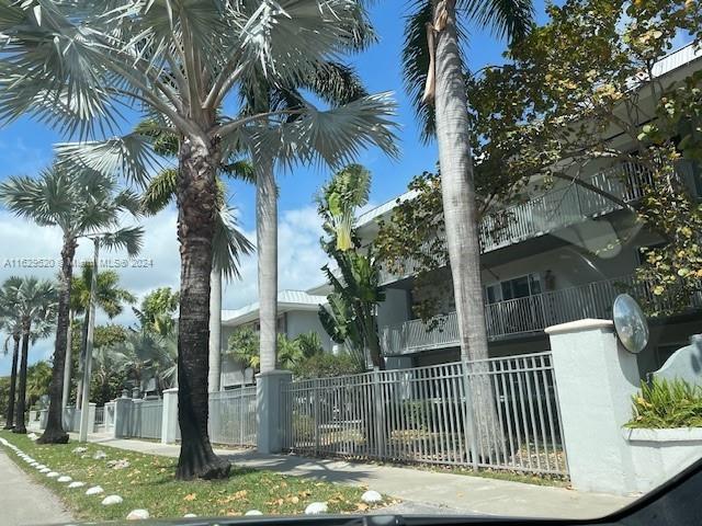 7403 SW 82nd St Unit 201N, Miami, FL 33143 - view of building exterior with a fenced front yard