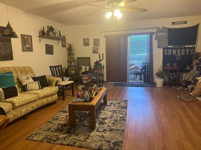 2271 NW 48th Ter Unit 114, Lauderhill, FL 33313 - living area featuring a ceiling fan, wood finished floors, and a textured ceiling