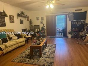 2271 NW 48th Ter Unit 114, Lauderhill, FL 33313 - living room featuring a ceiling fan and wood finished floors