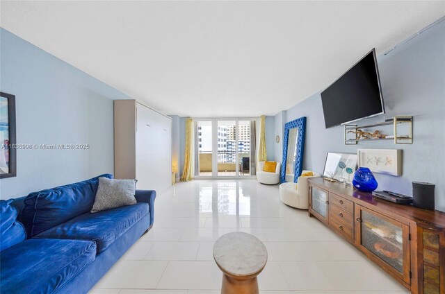 tiled living room with a wall of windows