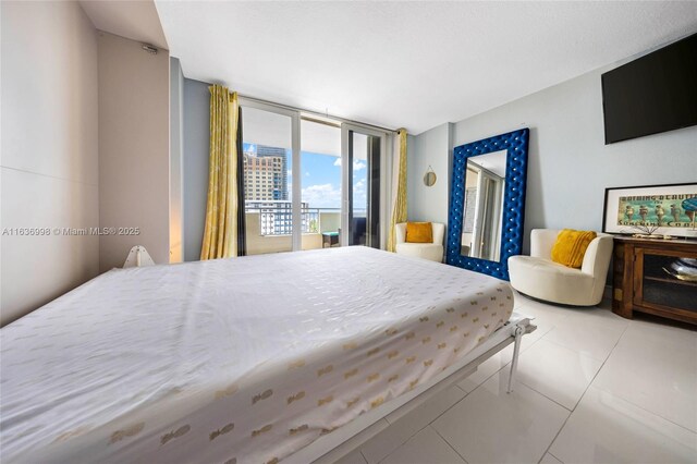 tiled bedroom featuring access to outside