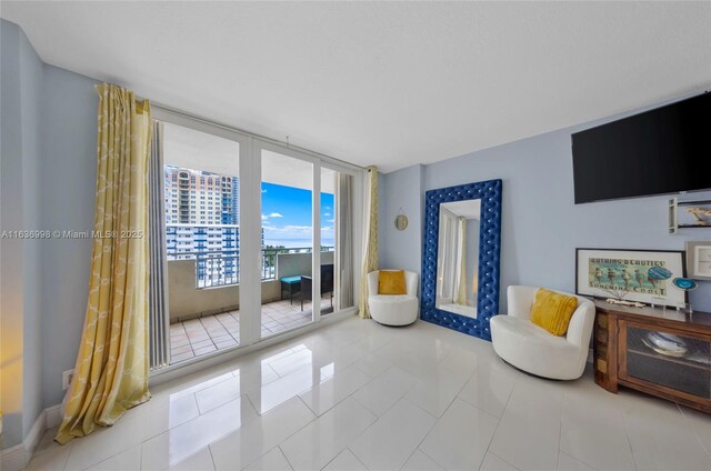 living area featuring light tile patterned flooring