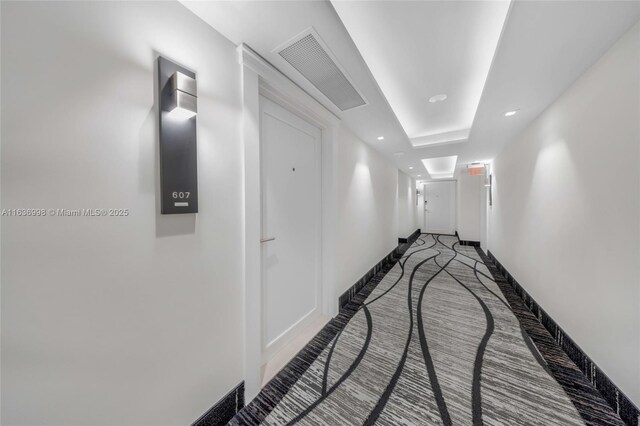 hallway featuring carpet floors