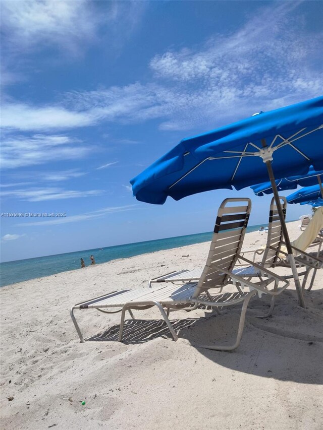 property view of water featuring a beach view